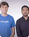 Two male Googlers featured in the video standing side by side.