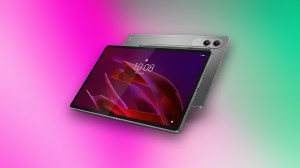 Lenovo Yoga tab on display against pink and green gradient CNET commerce background.