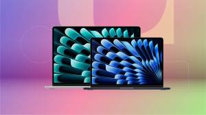 Two open MacBooks against a purple/pink/green gradient CNET background.