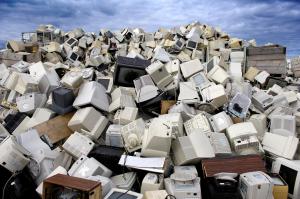A pile of computers and monitors