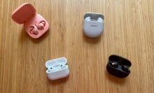 four pairs of earbuds on a table
