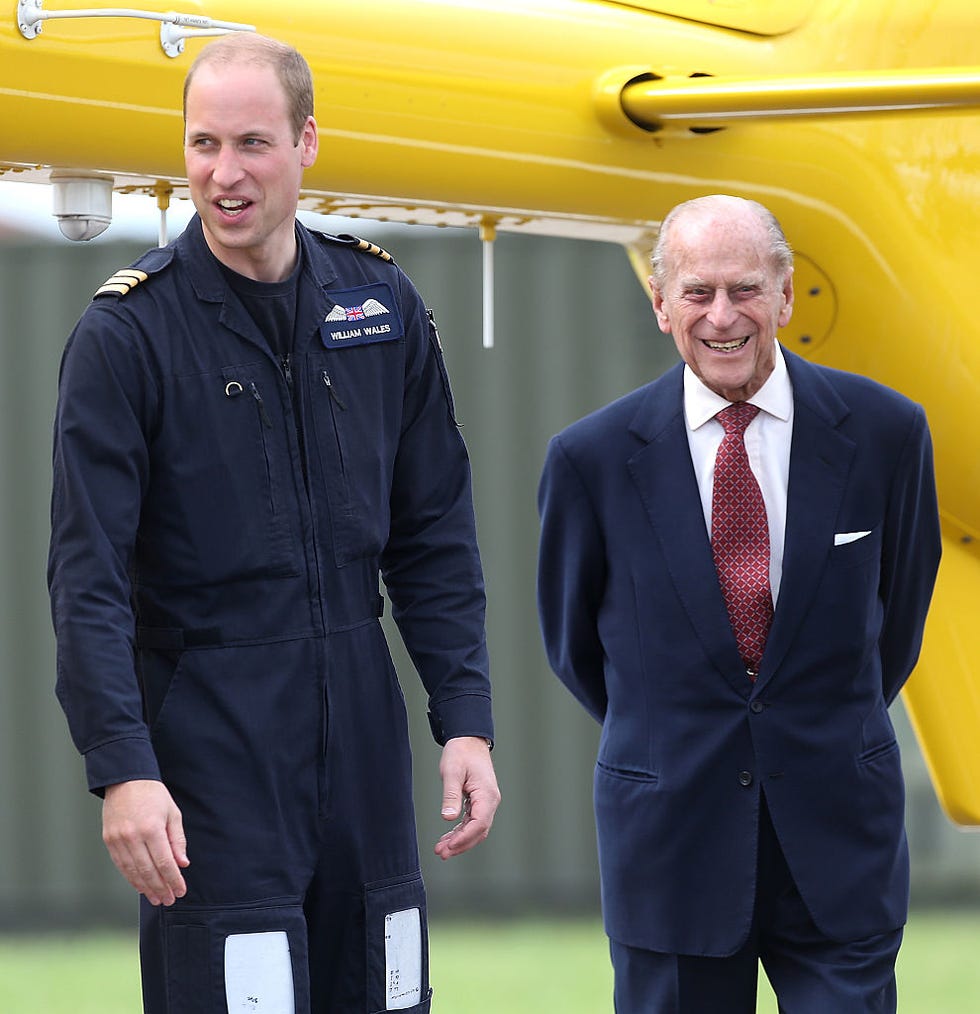 Prince William, Prince Philip Prince Philip with his grandson Prince William during a visit to the East Anglian Air Ambulance Base, 2013