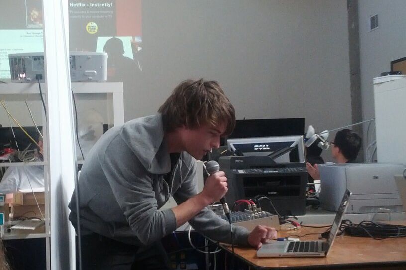 Image may contain Human Person Furniture Table Desk Electronics Computer Pc Lcd Screen Monitor Screen and Display